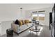 Bright living room featuring comfortable seating, scenic view, and modern decor at 8885 Lowell St, McCordsville, IN 46055