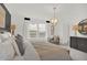 A well-lit main bedroom with an inviting bed, neutral tones, and a picturesque view from large windows at 8885 Lowell St, McCordsville, IN 46055