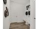 Bright mudroom features wood floors, bench seating, and decorative bike-themed wall art at 8885 Lowell St, McCordsville, IN 46055