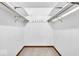 Spacious walk-in closet with built-in shelving and hanging rods for ample storage at 9031 Butternut Ct, Indianapolis, IN 46260