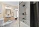 Updated bathroom features modern fixtures, sleek tiling, and a shower-tub combination at 916 N Bradley Ave, Indianapolis, IN 46201