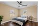 Cozy bedroom with a ceiling fan, hardwood floors, and plenty of natural light at 916 N Bradley Ave, Indianapolis, IN 46201