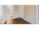 Hallway leads to the bathroom that has a sink, toilet and tub at 916 N Bradley Ave, Indianapolis, IN 46201