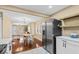 Open kitchen concept with modern appliances, dining area access, and contemporary style at 916 N Bradley Ave, Indianapolis, IN 46201