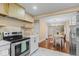 Kitchen showcasing modern appliances, light countertops and contemporary shelving and design at 916 N Bradley Ave, Indianapolis, IN 46201