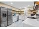 Bright and modern kitchen with white cabinets, stainless steel appliances and contemporary backsplash at 916 N Bradley Ave, Indianapolis, IN 46201