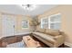 Comfortable living room showcasing large windows, hardwood floors, and a neutral color palette at 916 N Bradley Ave, Indianapolis, IN 46201