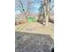 Large backyard with shed and trees at 9508 Conried Dr, Indianapolis, IN 46235