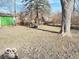 Yard with shed and large tree at 9508 Conried Dr, Indianapolis, IN 46235