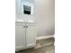 Clean bathroom with white vanity and gray flooring at 9508 Conried Dr, Indianapolis, IN 46235