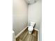 Simple bathroom with a toilet and wood-look flooring at 9508 Conried Dr, Indianapolis, IN 46235