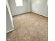 Spacious bedroom with neutral colored walls and brown carpeting at 9508 Conried Dr, Indianapolis, IN 46235