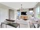 Open-concept living room with cozy seating, large windows for natural light, and modern decor at 1445 Bellows Ave, Franklin, IN 46131