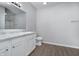 Bathroom with white vanity and shower at 1623 Capra Ct, Beech Grove, IN 46107