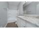 Clean bathroom with a shower/tub combo, vanity, and modern finishes at 1623 Capra Ct, Beech Grove, IN 46107