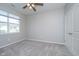 Bright bedroom with carpet flooring, neutral walls, and ceiling fan at 1623 Capra Ct, Beech Grove, IN 46107