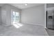 Dining area with sliding glass doors and kitchen access at 1623 Capra Ct, Beech Grove, IN 46107