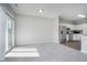 Dining area with sliding glass doors and kitchen access at 1623 Capra Ct, Beech Grove, IN 46107