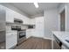 Modern kitchen with stainless steel appliances and white cabinets at 1623 Capra Ct, Beech Grove, IN 46107