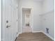 Laundry room with vinyl flooring and access to the bathroom at 1623 Capra Ct, Beech Grove, IN 46107