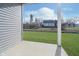 Small concrete patio overlooking a grassy backyard at 1623 Capra Ct, Beech Grove, IN 46107