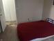 Bedroom with a red bedspread and closet at 1810 Farm Meadow Dr, Greenwood, IN 46143