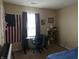Bedroom with an American flag, desk, and bookshelf at 1810 Farm Meadow Dr, Greenwood, IN 46143
