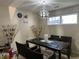 Bright dining room with a modern chandelier and table at 1810 Farm Meadow Dr, Greenwood, IN 46143