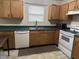 Galley kitchen with wood cabinets and appliances at 1810 Farm Meadow Dr, Greenwood, IN 46143