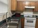 Kitchen area with wood cabinets and appliances at 1810 Farm Meadow Dr, Greenwood, IN 46143