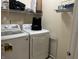 Laundry room with washer, dryer, and shelving at 1810 Farm Meadow Dr, Greenwood, IN 46143