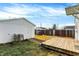 Backyard with wooden deck, detached garage, and fence at 1837 E Legrande Ave, Indianapolis, IN 46203