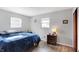 Spacious bedroom with blue comforter and wood nightstand at 1837 E Legrande Ave, Indianapolis, IN 46203