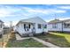 White house with a small front porch and walkway, nice lawn at 1837 E Legrande Ave, Indianapolis, IN 46203