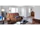 Cozy living room featuring brown recliner chairs and a coffee table at 1837 E Legrande Ave, Indianapolis, IN 46203