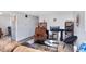 Living room with brown sofas, a TV and shelves at 1837 E Legrande Ave, Indianapolis, IN 46203