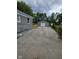 Long driveway leading to a detached garage, offering ample parking space at 2414 Walker Ave, Indianapolis, IN 46203