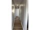 Long hallway with light gray walls and wood-look flooring at , Indianapolis, IN 46203