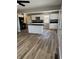 Spacious kitchen featuring a large island, white cabinets, and granite countertops at , Indianapolis, IN 46203