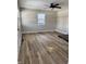 Bright living room with neutral walls and wood-look flooring at , Indianapolis, IN 46203