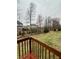 Back yard with lush green grass and mature trees, offering a relaxing view of the neighborhood at 2504 Fawn Bluff Ct, Zionsville, IN 46077