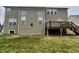 Large, two-story home exterior featuring a wood deck and a well-maintained backyard with healthy lawn at 2504 Fawn Bluff Ct, Zionsville, IN 46077