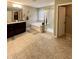 Bright bathroom features a soaking tub, a glass shower, and a large dark wood vanity at 2504 Fawn Bluff Ct, Zionsville, IN 46077