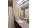 Bathroom featuring a large, modern mirror, granite countertops, and ample vanity storage at 2504 Fawn Bluff Ct, Zionsville, IN 46077
