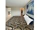 Bedroom boasts a decorative blue accent painting and a walk in closet at 2504 Fawn Bluff Ct, Zionsville, IN 46077