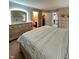 Bright bedroom featuring neutral walls, modern dressers and a large, walk-in closet at 2504 Fawn Bluff Ct, Zionsville, IN 46077