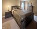 Bedroom features a large bed with a wood frame, two nightstands, and a dresser at 2504 Fawn Bluff Ct, Zionsville, IN 46077