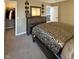 Carpeted bedroom featuring a large dresser with mirror, closet and queen size bed at 2504 Fawn Bluff Ct, Zionsville, IN 46077