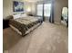 Cozy bedroom with large window, carpet, and a queen size bed with decorative blanket and pillows at 2504 Fawn Bluff Ct, Zionsville, IN 46077