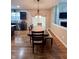 Traditional dining area featuring hardwood floors and a dark wood table set with seating for six at 2504 Fawn Bluff Ct, Zionsville, IN 46077